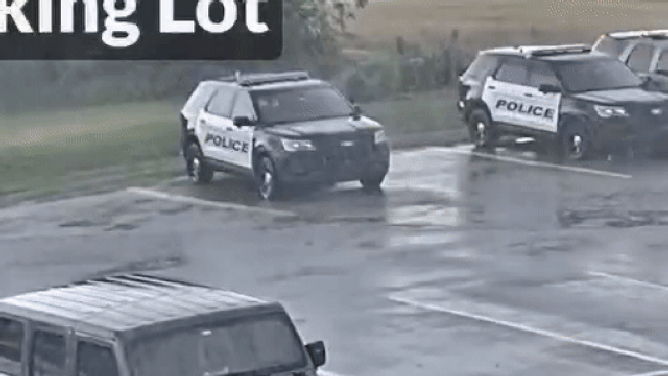 This animated image shows a bolt of lightning striking a police vehicle in Newcastle, Oklahoma, on Monday, May 19, 2025.