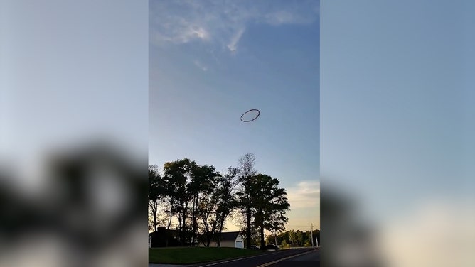 Bonner Springs, Kansas, resident Frankie Camren witnessed and recorded a large, dark smoke ring while riding his motorcycle on Monday. According to Camren, the ring appeared to be spinning, and he didn't hear any explosions or noises that could explain its origin.