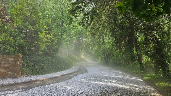 Crews in Asheville, NC clean up after hail and torrential downpours Thursday, May 8, 2025.