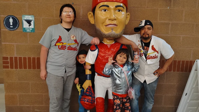 Juan Baltazar, right, and his 16-year-old son, 6-year-old daughter and 3-year-old son.
