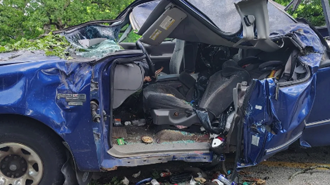 Juan Baltazar's blue Ford F-250 pickup truck was crushed by a tree during severe weather in St. Louis on May 16, 2025.