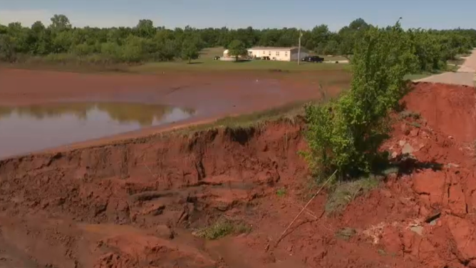 Flooding from severe storms washes out the road leading to Blanchard, OK, effectively cutting the town off from ground travel.