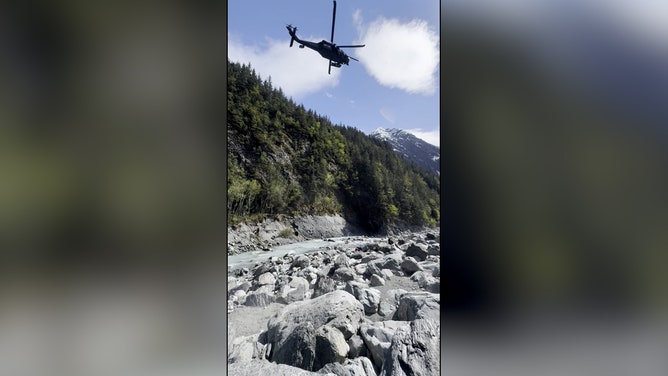 Rescuers found Morris lying face down in the creek with a 700-pound boulder pinning him while his wife held his head above the water.