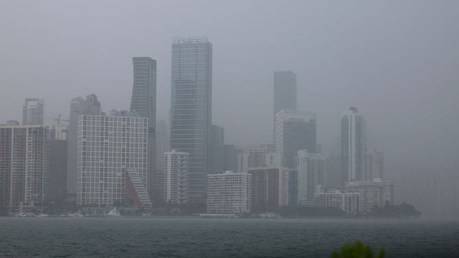 FILE - MIAMI, FLORIDA - APRIL 10: A rain squall passes over the skyline on April 10, 2023 in Miami, Florida. Reports indicate that there is almost $1.5 trillion of U.S. commercial real estate debt due for repayment before the end of 2025. The debt is causing concern for the banking sector that holds the loans. (Photo by Joe Raedle/Getty Images)