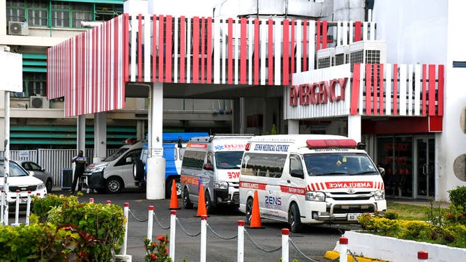 Ambulances are parked outside the emergency department of Lautoka Hospital in Lautoka, Fiji's second-largest city, on December 16, 2024. Fiji doctors have decided to discharge five of the seven patients -- including four Australians and an American -- who were hospitalised after drinking pina coladas at a luxury hotel bar, the government said on December 16.