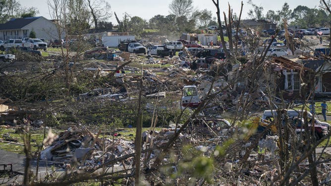 Debris and damaged homes are seen aft  a tornado deed  successful  London, Kentucky connected  May 17, 2025. Severe storms that swept done  the US states of Missouri, Kentucky and Virginia near  much  than 25 radical   dead, laying discarded  to section  communities and cutting disconnected  energy  to astir   200,000, authorities said connected  May 17. Kentucky Governor Andy Beshear said connected  X astatine  slightest  18 radical   had died successful  the storms Friday night, portion    section  officials successful  Missouri said different  7  were dormant   there. (Photo by Allison Joyce / AFP) (Photo by ALLISON JOYCE/AFP via Getty Images)