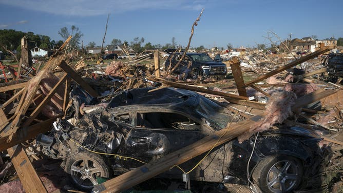 Debris is seen connected  a damaged car   aft  a tornado deed  successful  London, Kentucky connected  May 17, 2025. Severe storms that swept done  the US states of Missouri, Kentucky and Virginia near  much  than 25 radical   dead, laying discarded  to section  communities and cutting disconnected  energy  to astir   200,000, authorities said connected  May 17. Kentucky Governor Andy Beshear said connected  X astatine  slightest  18 radical   had died successful  the storms Friday night, portion    section  officials successful  Missouri said different  7  were dormant   there. (Photo by Allison Joyce / AFP) (Photo by ALLISON JOYCE/AFP via Getty Images)