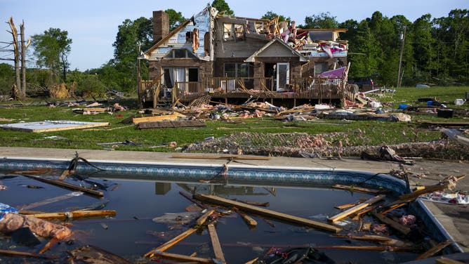 LONDON, KENTUCKY - MAY 18: Debris floats in a pool near a severely damaged house on May 18, 2025 in the community of Sunshine Hills outside of London, Kentucky. A tornado struck the neighborhood of Sunshine Hills just after midnight on May 17, 2025 in London, Kentucky. (Photo by Michael Swensen/Getty Images)