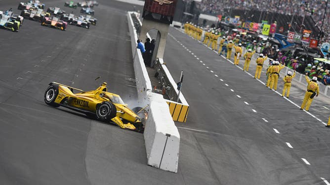 Scott McLaughlin (#3 Team Penske Chevrolet) run crunches his race car against pit wall at the end of the front straightaway with one lap to go before the initial green flag to start the Sunday, May 25, 2025, 109th Indianapolis 500 at Indianapolis Motor Speedway in Speedway, Indiana.