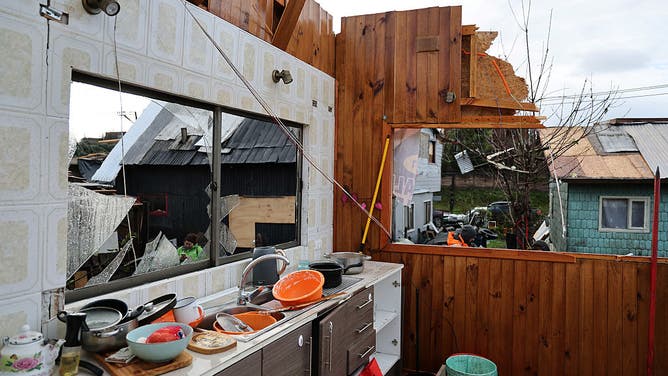 View of a damaged house after the passage of a tornado in the city of Puerto Varas, Region de los Lagos, southern Chile, on May 26, 2025.