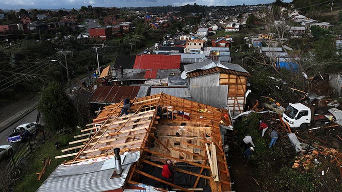 This aerial view shows damages following the passage of a tornado in the city of Puerto Varas, Region de los Lagos, southern Chile, on May 26, 2025.