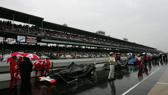 INDIANAPOLIS - MAY 27: Cars sit in pit lane during a rain delay at the IRL IndyCar Series 91st running of the Indianapolis 500 at the Indianapolis Motor Speedway on May 27, 2007 in Indianapolis, Indiana.
