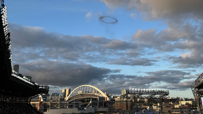 A smoke ring forms over downtown Seattle on March 30, 2025.