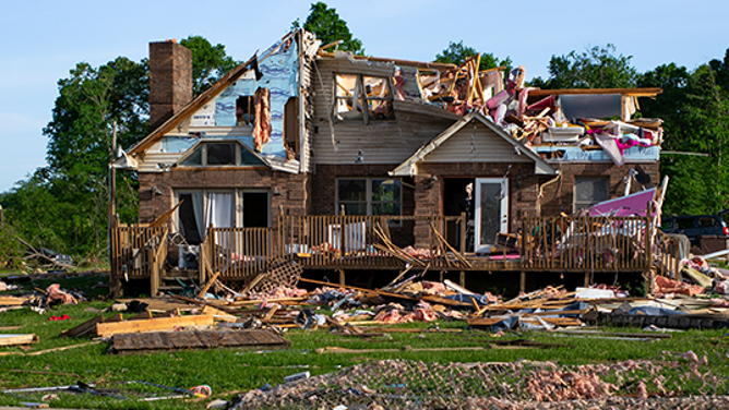 LONDON, KENTUCKY - MAY 18: Debris floats in a pool near a severely damaged house on May 18, 2025 in the community of Sunshine Hills outside of London, Kentucky. A tornado struck the neighborhood of Sunshine Hills just after midnight on May 17, 2025 in London, Kentucky. (Photo by Michael Swensen/Getty Images)