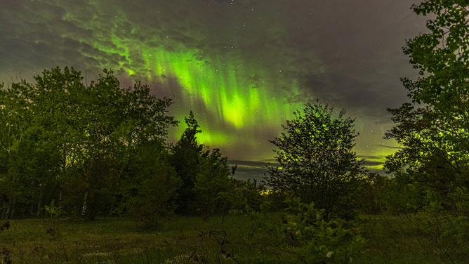 A Michigan photographer captured these views of the Northern Lights over Hancock, Michigan early on Thursday, May 29, 2025 during a strong geomagnetic storm.