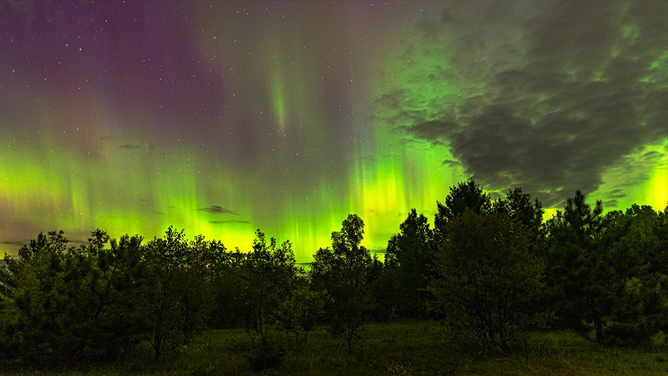A Michigan photographer captured these views of the Northern Lights over Hancock, Michigan early on Thursday, May 29, 2025 during a strong geomagnetic storm.