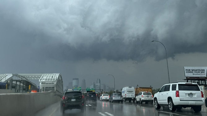 Storm clouds loom implicit    Minnesota drivers connected  Thursday.