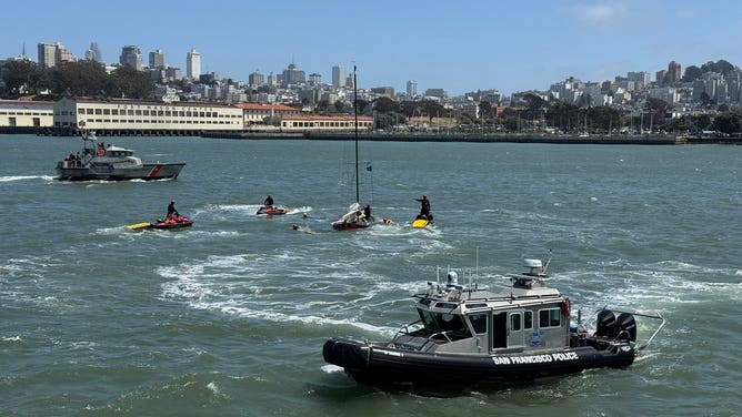 A sailboat captain clings to the ropes of a sinking vessel in San Francisco on May 24, 2025.