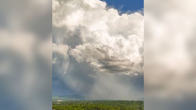 Storms move over Asheville, NC on Thursday, May 8, 2025.