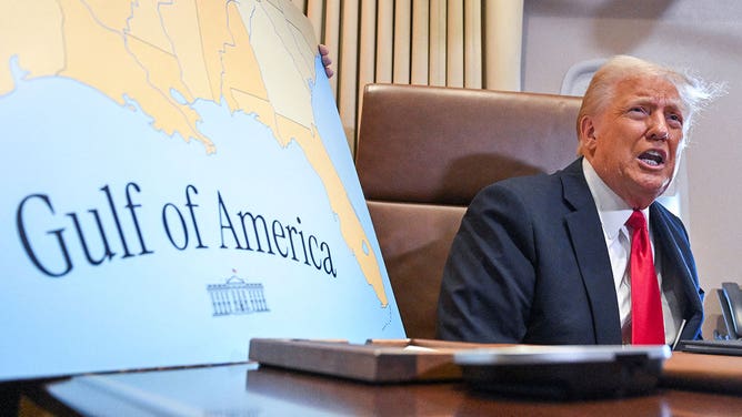 President Donald Trump speaks to the press before signing a proclamation renaming the Gulf of Mexico as the Gulf of America aboard Air Force One enroute to New Orleans, Louisiana on February 09, 2025.