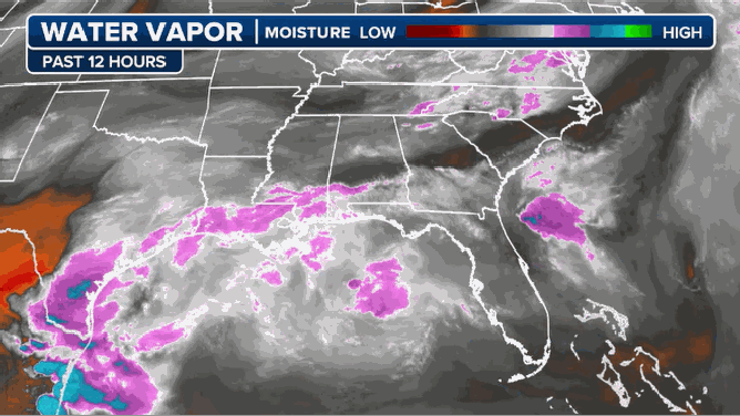 The striking blue and green patterns on this water vapor map signal a surge of tropical moisture associated with the low-pressure system.