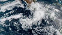 Hurricane Erick strengthens with 100-mph winds as it rapidly intensifies in Eastern Pacific