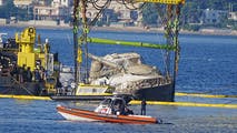 Sunken British superyacht lifted from seafloor