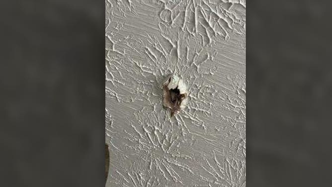 Damage is seen at a home in Henry County, Georgia, after an apparent meteor hit a home on June 25, 2025.