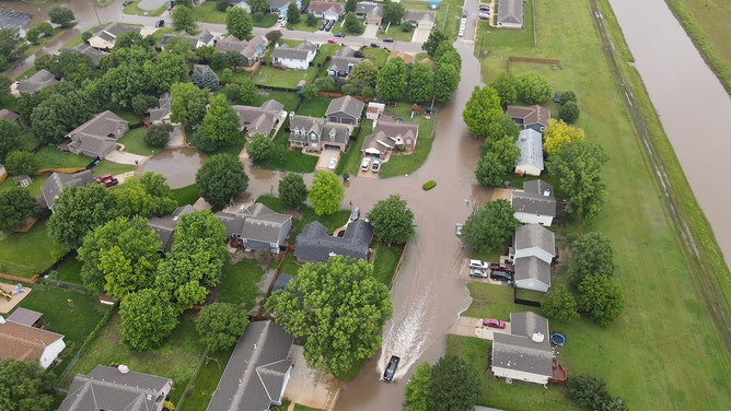 Drone footage reveals the devastating extent of flash flooding that swallowed homes and roads in Valley Center, Kansas, on Tuesday.