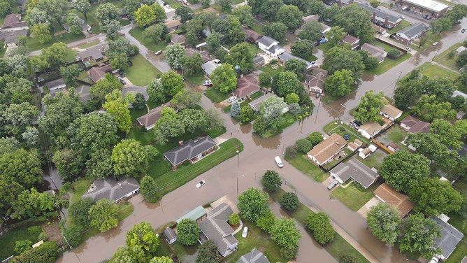 Drone footage reveals the devastating extent of flash flooding that swallowed homes and roads in Valley Center, Kansas, on Tuesday.