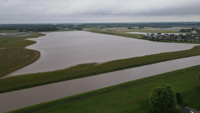 Drone footage reveals the devastating extent of flash flooding that swallowed homes and roads in Valley Center, Kansas, on Tuesday.