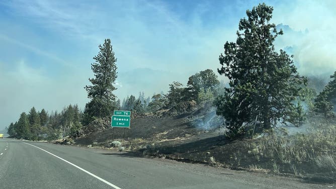 Smoke from the Rowena Fire hangs over the road.