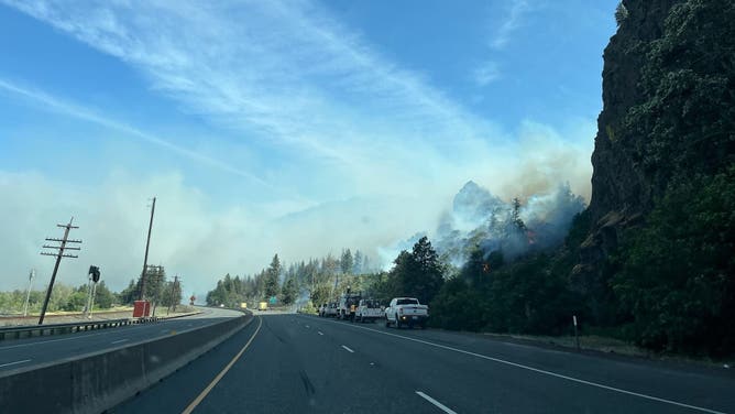 Smoke from the Rowena Fire hangs over the road.