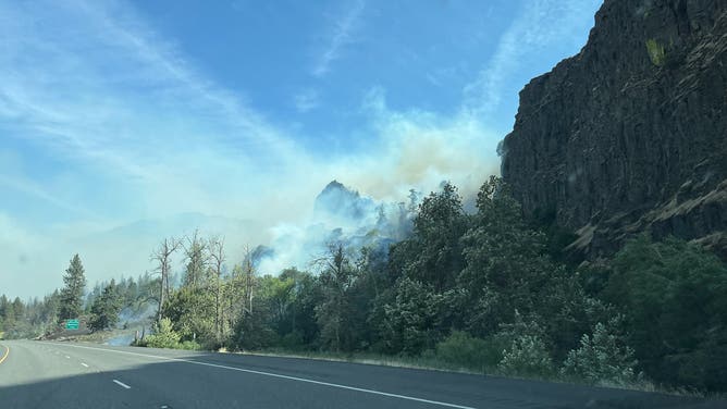 Smoke from the Rowena Fire hangs over the road.