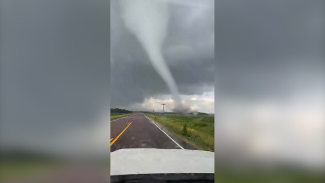 Multiple tornadoes were reported by the National Weather Service in southeastern Minnesota on Wednesday afternoon. Video footage from Hartland, Minnesota, shows a tornado towering over a car with debris swirling in the air. A Tornado Warning for the area expired at 5 p.m. Wednesday.