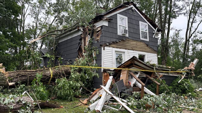 An EF-1 tornado sent tree limbs crashing into homes leaving three dead,