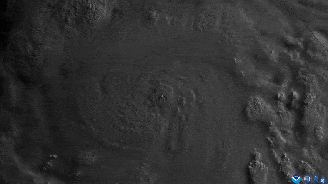 NOAA satellite imagery shows a visible eye developing within a rapidly intensifying Hurricane Erick.