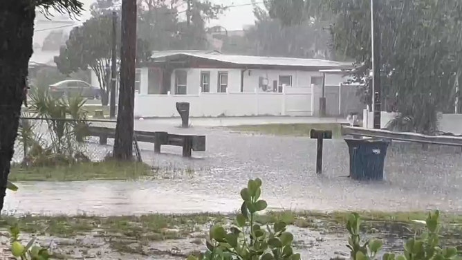 A suburban road began to flood in Tampa, Florida, on Monday, as the National Weather Service issued a Severe Thunderstorm Warning for the area.