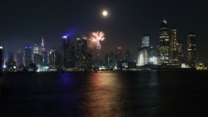 Macy's Fireworks on the Empire State Building as the Full Buck Moon Rises in New York City