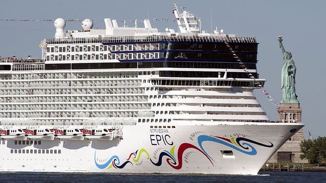 FILE - The cruise ship Norwegian Epic sails past the Statue of Liberty July 1, 2010 in New York Harbor. The Norwegian Cruise Line ship, on her Maiden Voyage from Southampton to New York, is claimed to be the largest ship to ever dock in a New York Passenger Ship Terminal. AFP PHOTO/DON EMMERT (Photo credit should read DON EMMERT/AFP via Getty Images)
