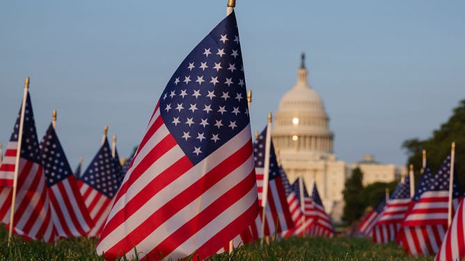 FILE - WASHINGTON, DC - JUNE 2: American flags are displayed on the lawn of the National Mall with the U.S. Capitol Building in the background at sunset on June 2, 2025 in Washington, DC. (Photo by Kevin Carter/Getty Images)