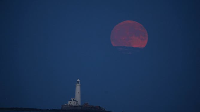 The full moon, also known as the Strawberry Moon rises rises over St Mary's Lighthouse in Whitley Bay. Picture date: Tuesday June 10, 2025.