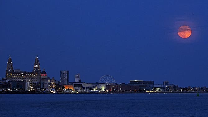 The full moon, also known as the Strawberry Moon rises over Liverpool, Merseyside. Picture date: Tuesday June 10, 2025.