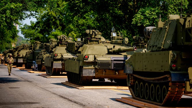WASHINGTON, DC - JUNE 11: U.S. Army soldiers work on an assortment of M1 Alpha a3 Abrams tanks, stryker armored vehicles, and M2 Bradley fighting vehicles at West Potomac Park along the Potomac River on June 11, 2025 in Washington, DC. Tanks and other heavy military equipment have arrived in the Nation's Capital for a military parade in honor of the U.S. Army's 250th anniversary, which coincides with President Donald Trump's birthday and Flag Day.