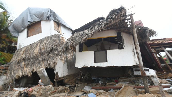 A view of damage caused by Hurricane Erick after it made landfall in Santa Maria Tonameca, Oaxaca, Mexico, on June 20, 2025. The storm, downgraded to a tropical storm after hitting as a Category 3 hurricane, disrupted infrastructure, blocked 15 road sections, and left 123,000 users without power.