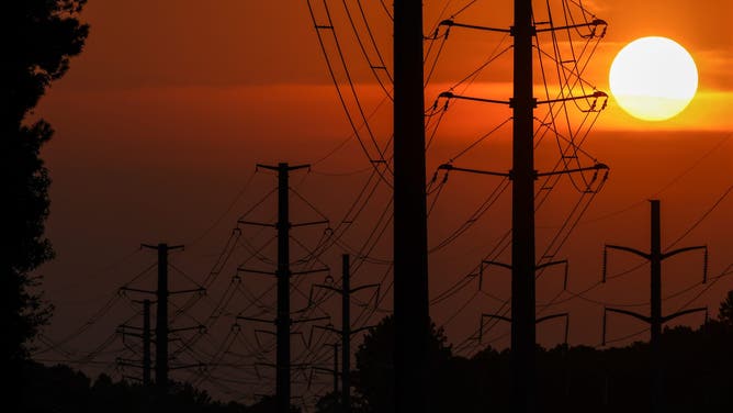 Power transmission lines during high temperatures in Columbia, South Carolina, US, on Tuesday, June 24, 2025. The Trump administration has declared a power emergency in the US Southeast as a blistering heat wave strains grids across the country. Photographer: Sam Wolfe/Bloomberg via Getty Images