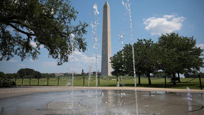 WASHINGTON, DC - JUNE 24: A fountain in front of the Washington Monument sprays water on the National Mall on June 24, 2025 in Washington, DC. Temperatures soared this week as the National Weather Service issued an Extreme Heat Warning in Washington, DC from 11 a.m. to 9 p.m on June 23 and 24th, with temperatures hitting a heat index of up to 110 degrees. (Photo by Kayla Bartkowski/Getty Images)