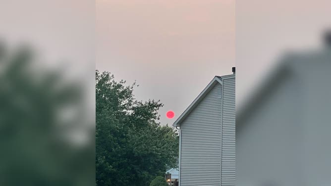 Canadian wildfire smoke turns sunset orange-red in O'Fallon, Illinois on Sunday, June 1, 2025.