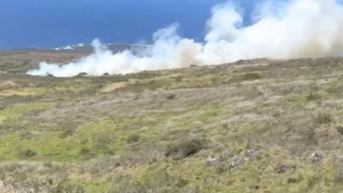 A brush fire burning on Maui on Sunday, June 15, 2025 leading to evacuations.