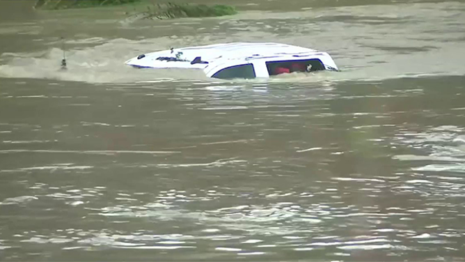 This image shows a vehicle submerged in floodwaters in San Antonio on Thursday, June 12, 2025.